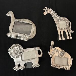 Grouping of small pewter animal picture frames.